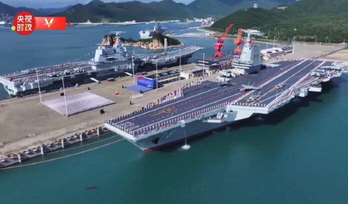 China inducts Fujian Aircraft Carrier चीन ने तीसरा विमानवाहक पोत फुजियान समुद्र में उतारा