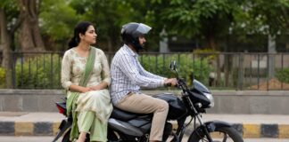 Women sit sideways bike