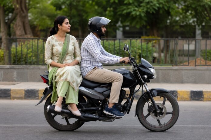 Women sit sideways bike