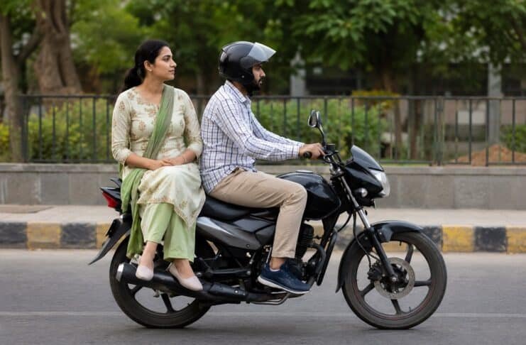 Women sit sideways bike